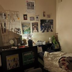 a bed room with a neatly made bed and pictures on the wall