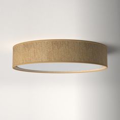 a round light fixture hanging from the ceiling