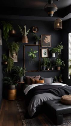 a bedroom with black walls and lots of plants