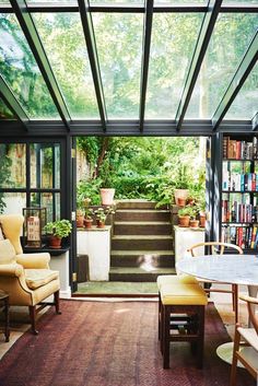 an image of a room with stairs and plants