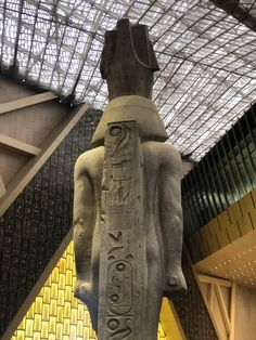 an egyptian statue in the middle of a building