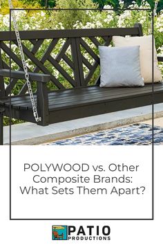 a wooden bench sitting on top of a patio next to a white and blue rug