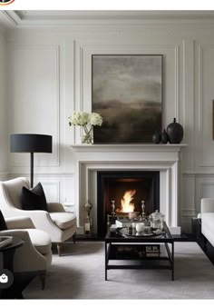 a living room filled with furniture and a fire place in the middle of a room