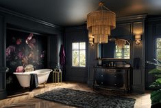 the bathroom is decorated in black and gold with flowers on the wall behind the bathtub