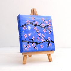 a small easel with a painting on it