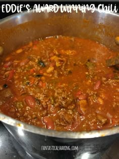 a large pot filled with food sitting on top of a stove