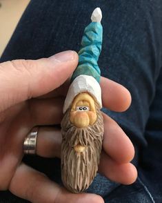 a small figurine in the shape of a gnome's head