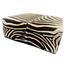 a zebra print box sitting on top of a white surface