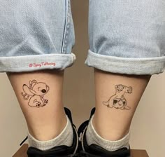 two small tattoos on the legs of someone's feet, one with a dog and another with a puppy