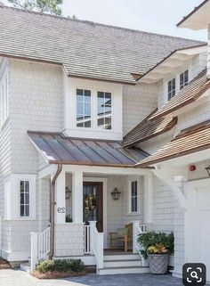 a white house with a metal roof