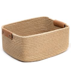 an empty basket with leather handles on a white background