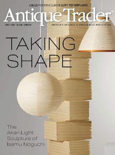 the cover of antiques trader magazine showing wooden lamps and books hanging from strings, with text that reads taking shape