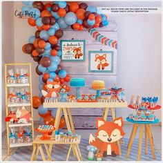 a birthday party with fox decorations and balloons