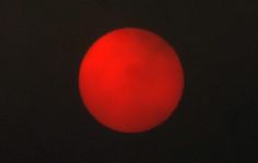 a red ball is seen in the dark sky with no light on it's side