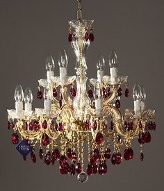 a fancy chandelier with red and white candles