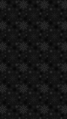 black and white snowflakes on a dark background