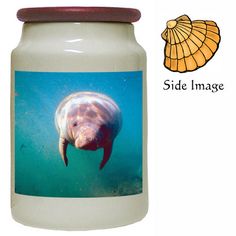 a jar with an image of a manatoo swimming in the water next to it