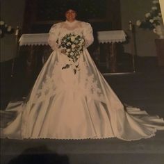 an old photo of a woman in a wedding dress