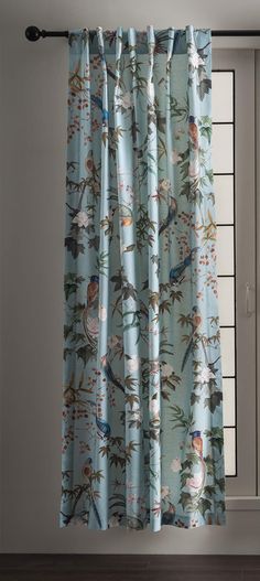 a curtain with birds and flowers on it