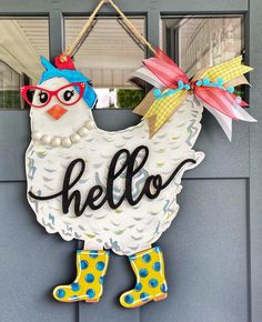 a door hanger that says hello with a chicken wearing glasses and polka dot boots