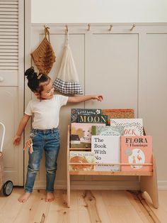 THE PRODUCT IS READY FOR SHIP! This stylish book storage encourages placing books at a kid's level in an organized way while the little one has absolute freedom to choose any book. Our front-facing wooden shelves for books allow your kid to see the whole range of books more easily. Besides, our bookshelves promote independence - the little readers can reach all the books! Since there's a limited number of books available on display, the little one will concentrate on each book more. Plus, parents can always rotate the collection in accordance with the kid's current interests, the season, or a topic that it would be nice for a kid to discover. You're welcome to display the whole collection of books of different sizes while eye-friendly and neutral colors of kid's bookshelves never distract Toddler Bookcase, Shelves For Books, Shelf Nursery, Montessori Bookshelf, Easy Shelves, Kids Bookshelf, Nursery Bookshelf, Montessori Furniture, Kids Bookcase