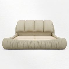 an upholstered bed with pillows on the top and bottom is made out of fabric