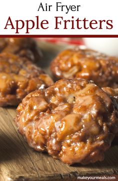 apple fritters on a cutting board with text overlay that reads, air fryer apple fritters