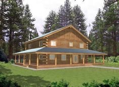 a large log cabin house in the middle of a forest with lots of trees around it