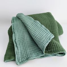 two green towels folded on top of each other