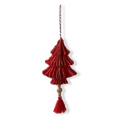 a red christmas tree decoration hanging from a string