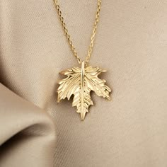 PLEASE READ FULL DESCRIPTION & SHOP POLICIES 14K Solid Gold Leaf Necklace - Fall Leaf Necklace - Gold Loose Leaf Necklace - Autum Leaf Gold Necklace - Canada Leaf Necklace - Gift For her ★★ Description ★★ Our 14K Solid Gold Leaf Necklace, inspired by the beauty of fall, is a simple yet elegant piece. Choose from gold, rose gold, or white gold to match your style. The necklace features a leaf pendant measuring 16.50mm x 14.70mm, attached to a slender cable chain. The chain length can be adjusted from 16 to 18 inches, making it versatile for different outfits. This leaf necklace is perfect for adding a touch of nature-inspired charm to your look. ★★ Necklace Details ★★ ◎ Material: 14 K Gold (585)(not silver)(not filled) ◎ Color Availability: Gold, Rose Gold, White Gold ◎ Chain Thickness 0.89 Gold Pendant Designs, Canada Leaf, Leaf Necklace Gold, Unique Wedding Jewelry, Gold Leaf Necklace, Autumn Necklace, Preppy Jewelry, Gold Heart Ring, Unique Pendant Necklace