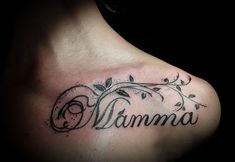 a close up of a person's chest with a tattoo that says namma on it