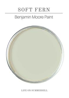 a white paint with the words soft fern on it, and an image of a round mirror