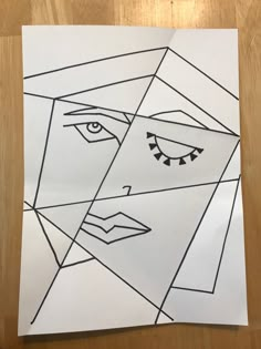 a piece of paper with an image of a woman's face drawn on it