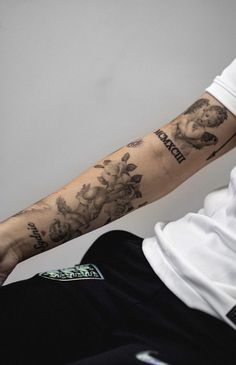 a man with a tattoo on his arm