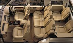 the interior of a car with beige leather seats