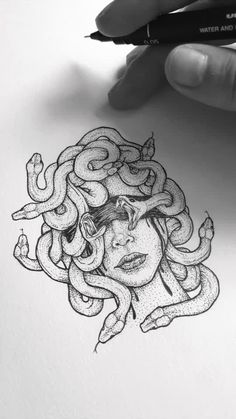 a drawing of a woman's head with snakes around her neck and hands holding a pen