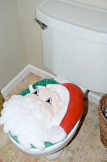 there is a toilet with a santa clause on it