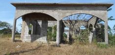 an abandoned building in the middle of nowhere