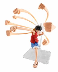 the action figure is being displayed in front of a white background with an orange and black hair