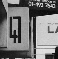 an old black and white photo of boxes on the side of a building that says water lane street london w1