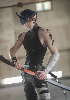 a man with black hair and tattoos holding two swords in one hand and an orange lighter in the other