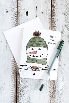 a card with a drawing of a snowman on it