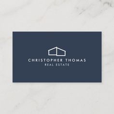 a real estate agent business card with the logo for a home builder and remodeling company