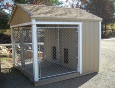 a small dog house with a fence around it