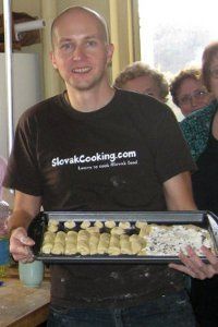 a man holding a tray of food in his hands