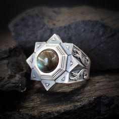 Inspired by the Seljuk star, this ring has eight corners, each representing a different virtue. These virtues are listed as compassion, love, patience, secrecy, generosity, loyalty, gratitude and honesty. Traces of this meaningful motif are frequently found in Seljuk architecture. In addition, it is seen that this motif is used in many works of traditional Turkish arts, from carpets to handcrafted products. The product is meticulously crafted from pure 925 sterling silver and is of exceptional quality. The ergonomic design ensures a comfortable fit for everyday wear. Each ring is custom-made according to your or your loved one's finger size, making it a personalized treasure. The ring has a matte and oxidized finish so that the details can be deeply felt. If you wish, we can also make it i Seljuk Architecture, Tarnished Silver Jewelry, Love Patience, Turkish Art, Jewelry Care Instructions, Labradorite Ring, Mens Ring, Design Jewelry, Cultural Heritage