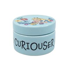 a small blue tin with the word curious on it's lid and an image of a