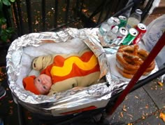 a hot dog with mustard and ketchup in a cart