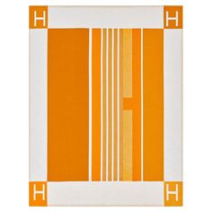 an orange and white area rug with vertical lines on the bottom, in two different colors